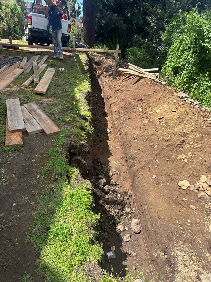 picture of a newly excavated backyard getting ready for foundation to be put in